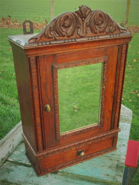 A very useful bathroom cabinet this wall hung shelved the solid mahogany rack stands on arched feet with a pair of turned columns on each side rising to a domed top supporting three pairs of spaced cross bars. Antique French Carved Wood Medicine Bathroom Wall Cabinet ...