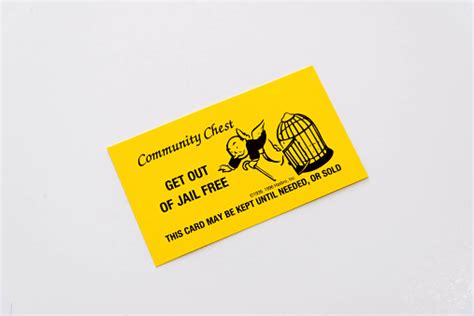 Purchasing the get out of jail free card from another player and playing it. Monopoly Pieces And Get Out Of Jail Free Card Stock Photo - Download Image Now - iStock