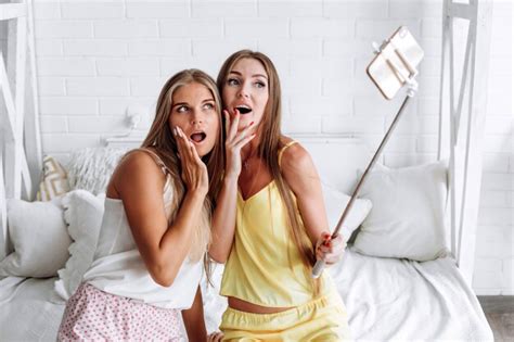 Premium Photo Surprised Girls Take Selfies