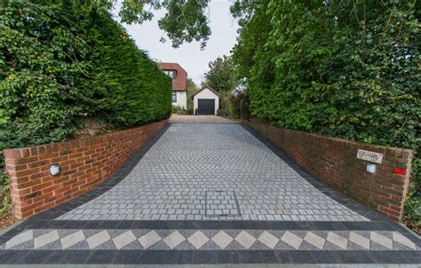 A Traditional Cobble Driveway Featuring A Bespoke Border Marshalls