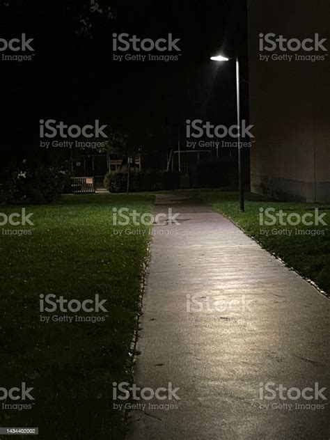 Street Light Shining On A Sidewalk Stock Photo Download Image Now