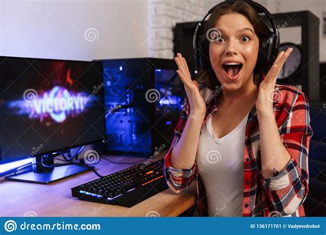 Girl Gamer Playing Video Game With Wireless Joystick At Home Gamepad