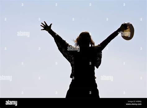 Raised Arms Woman From Behind Stock Photo Alamy