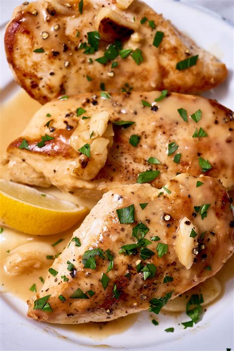 Pan seared chicken breast drizzled with a lemon garlic butter cream sauce. Recipe: Slow Cooker Lemon-Garlic Chicken Breast | Kitchn