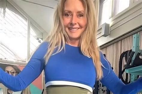 Carol Vorderman Distracts Fans With Best Bum As She Squats In Clingiest Outfit Yet