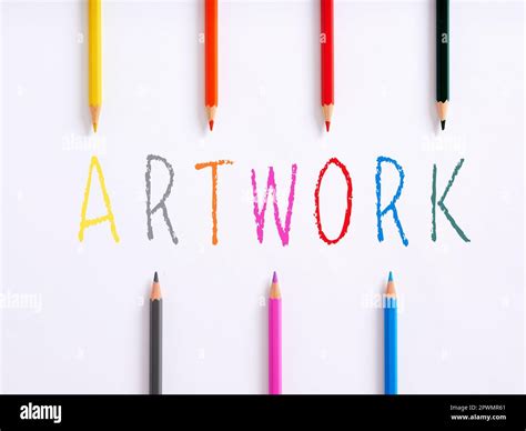 The Handwritten Word Artwork And Colorful Crayons On White Background