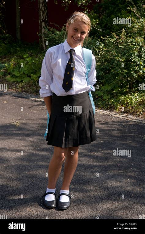 Portrait Of A Smiling Happy Schoolgirl Wearing Uniform Stock Photo Alamy