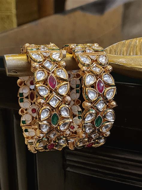 Set Of Two Openable Kundan Kadas With Ruby And Green Stones And Gold