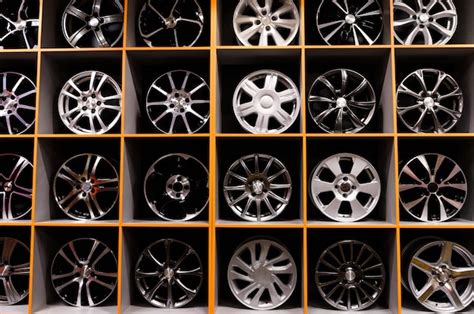 Premium Photo Wall Of Alloy Car Wheels And Pneumatic Tires In Store