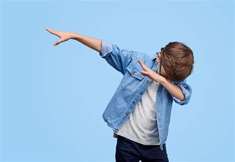 Stylish Kid Performing Dab Dancing Stock Photo Download Image Now