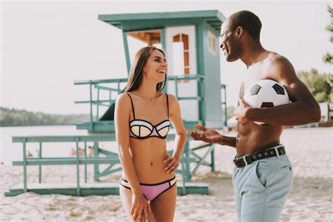 Premium Photo Romantic Girl And Guy Flirting On Beach