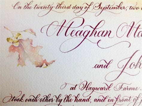 An Ornate Wedding Card With Calligraphy On It