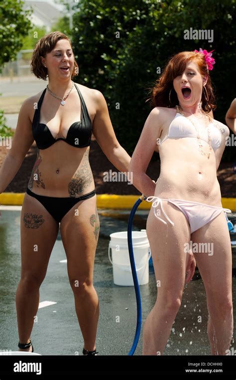 Two Women In Bikini Swimsuits Having Fun With A Garden Play Hot Sexy