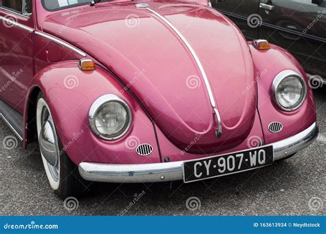 Front View Of Pink Volkswagen Beetle Parked In The Street Editorial