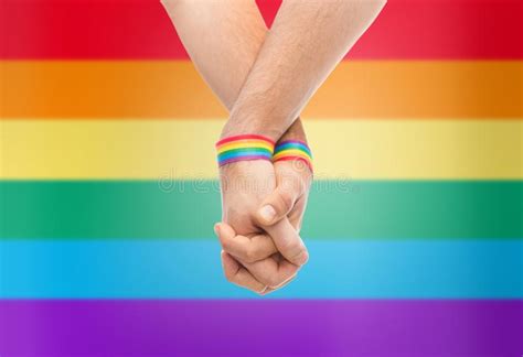 Hands Of Couple With Gay Pride Rainbow Wristbands Stock Image Image