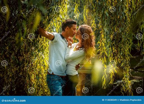 Male And Female Kissing Under Green Tree Stock Image Image Of Lovers Male 113038349
