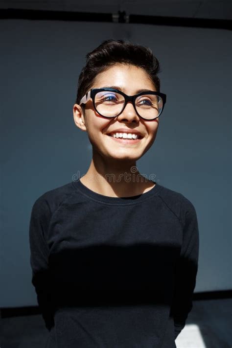 Portrait Of Young Beautiful Brunette Girl In Glasses Smiling Stock