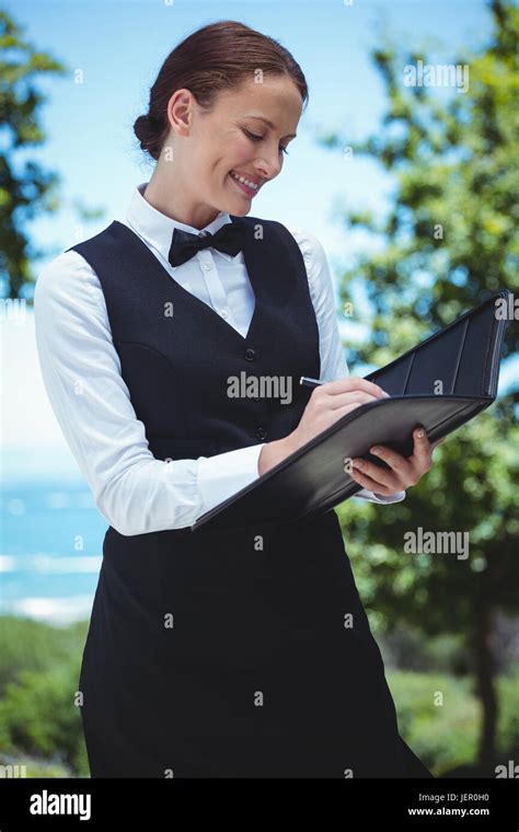 Smiling Waitress Taking An Order Stock Photo Alamy
