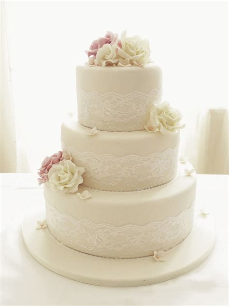 Ivory Roses And Lace Three Tier Wedding Cake