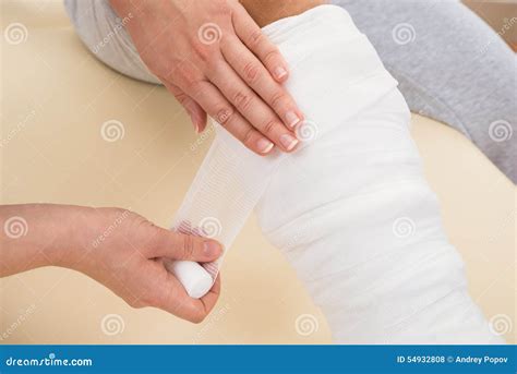 Doctor Bandaging Patient S Leg Stock Photo Image Of Ankle Adult