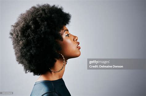 Side Profile Of A Beautiful Young Black Woman Thinking And Looking