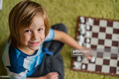 Smiling Boy Playing Chess High Res Stock Photo Getty Images