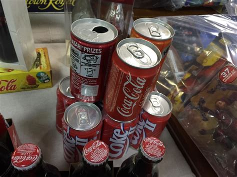 Collection Of Coca Cola Cans And Bottles Including 50th Anniversary