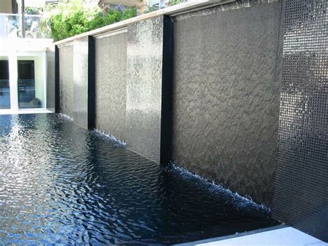 Modern pool design features small, inch square glass tiles that are shown here at the waterline. 23 best images about Water feature on Pinterest | Wall ...