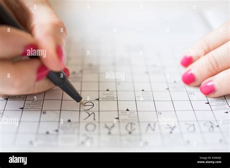 Woman Doing Crossword Puzzle Stock Photo Alamy