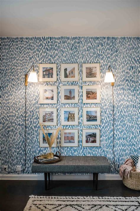 Accent Wall Painted With Blue Brush Strokes And A Grid Of Artwork How