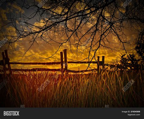 Old Wooden Fence And A Gold Sunset With Wheatfield Texas Hill Country