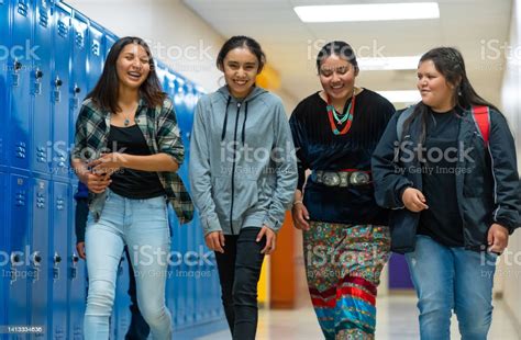 Group Of High Schoolers Walking On A Corridor Stock Photo Download