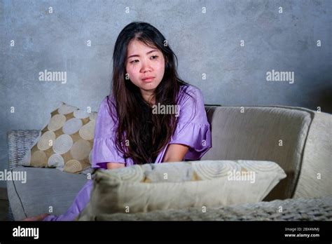 Young Sad And Depressed Asian Chinese Woman Crying Alone Desperate