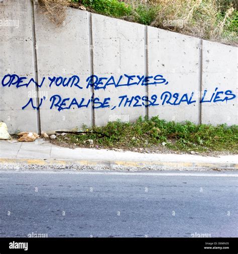 Graffiti Open Your Real Eyes And Realise These Real Lies Stock Photo