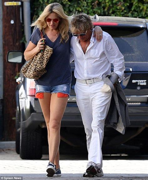 lean on me penny lancaster gives weary husband rod a helping hand as she shows off her toned
