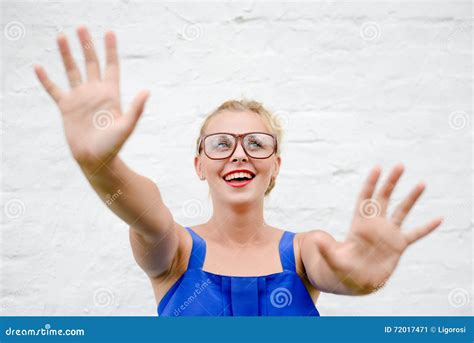 Portrait Of Happy Beautiful Blonde Girl Throws Up Her Hands In Grabbing Move Stock Image Image
