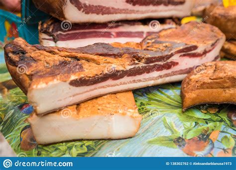 Homemade Smoked Bacon Arranged For Sale In A Village Fair Stock Photo