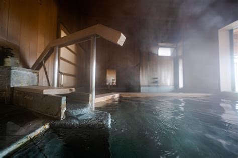 Premium Photo A Steamy Hot Tub In A Room With A Wooden Staircase