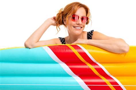 Girl With Inflatable Swimming Circles And Mattresses On Vacation On A White Background Stock