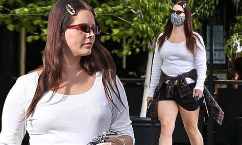 Lana Del Rey Keeps It Casual Cool In White Top And Tiny Black Shorts While Shopping In Beverly Hills