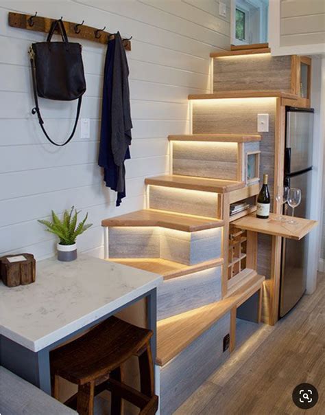 Illuminated Staircase Pull Out Shelf Over Wine Cubbies Tiny House