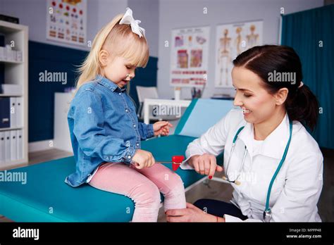 Doctor Examining Girl In Medical Practice Stock Photo Alamy