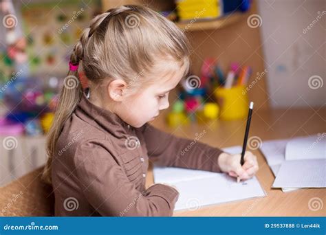 Cute Little Girl Writing Her Homework Royalty Free Stock Photos Image