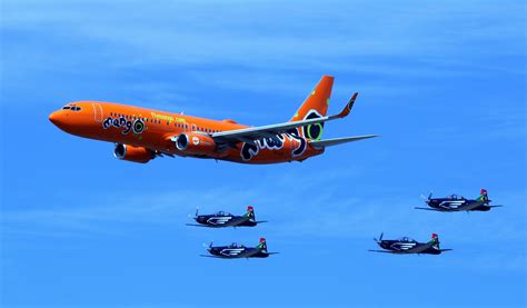 Orange Commercial Plane And 4 Black Jet Planes Free Image Peakpx
