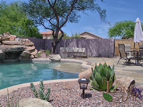 This Landscape Features A Fire Pit Barbecue Flagstone Deck And Pool