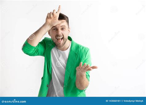 Losers Go Home Portrait Of Happy Guy Showing Loser Sign Over Forehead