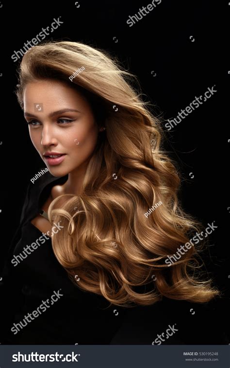 Honey blonde is a gorgeously warm blonde hair color. Beautiful Long Hair Fashion Female Model Stock Photo ...