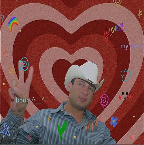 A Man Wearing A Cowboy Hat Making The V Sign With His Hand In Front Of