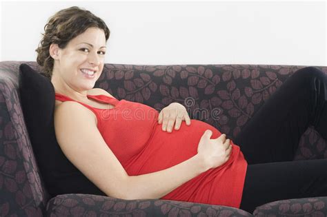 Smiling Pregnant Woman Relaxing On Sofa Stock Image Image Of House Newlife 33894215