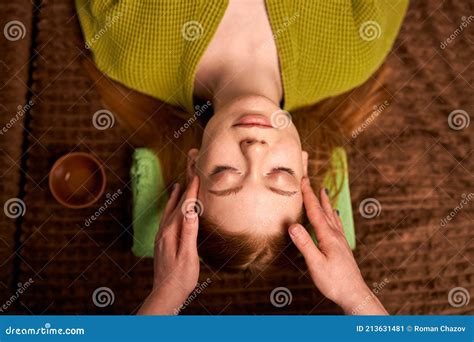Hands Of Masseuse Making Manual Massage Of Head To Beautiful Client